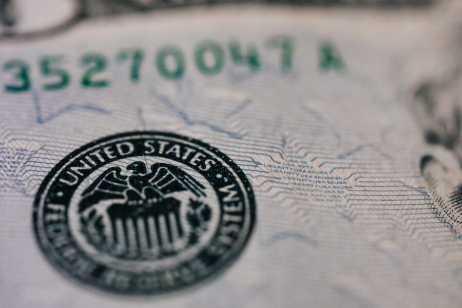 A close up of the federal reserve seal on a us dollar bill.
