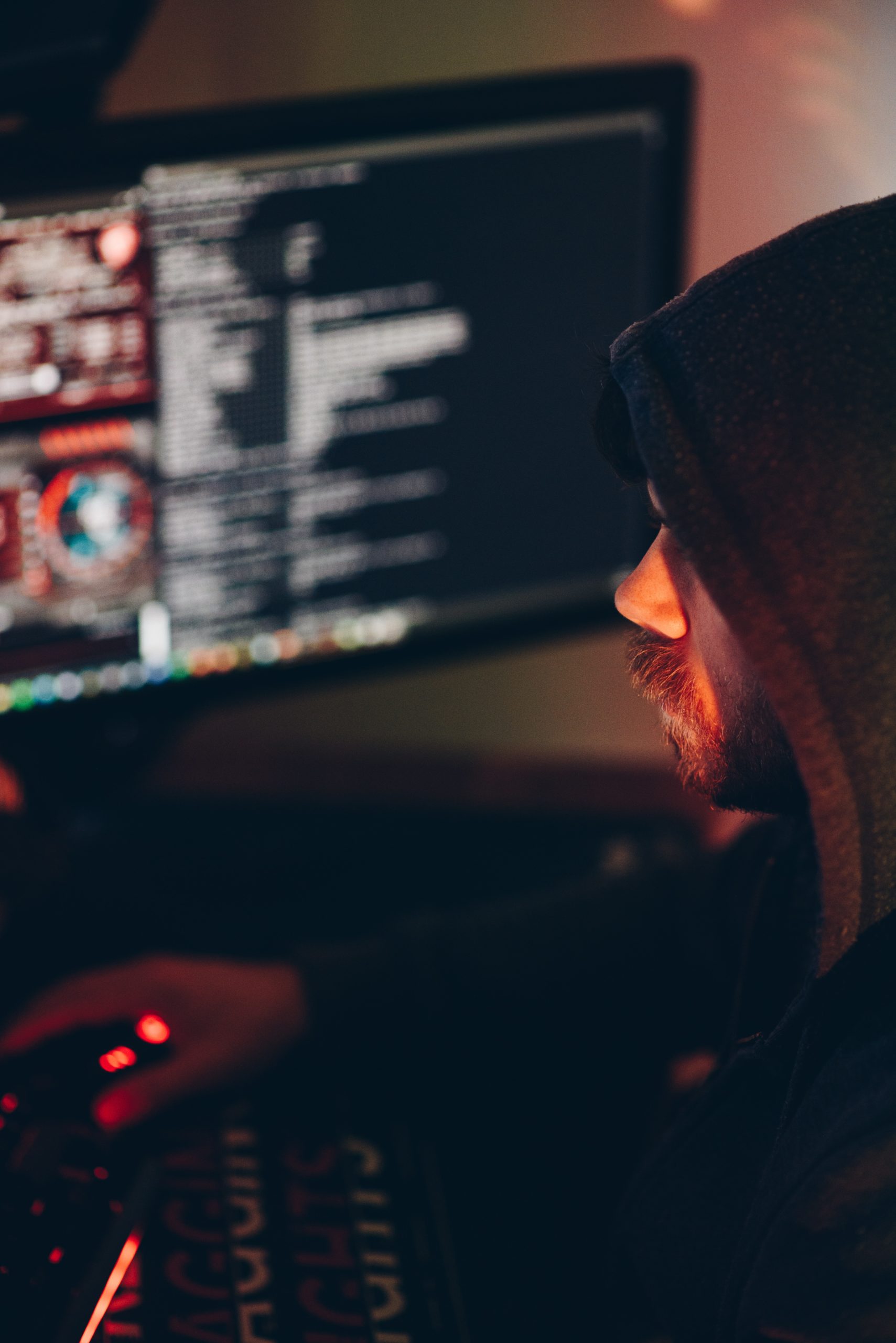 A person sitting in front of a computer screen.