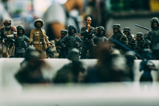 A group of toy soldiers sitting on top of a table.